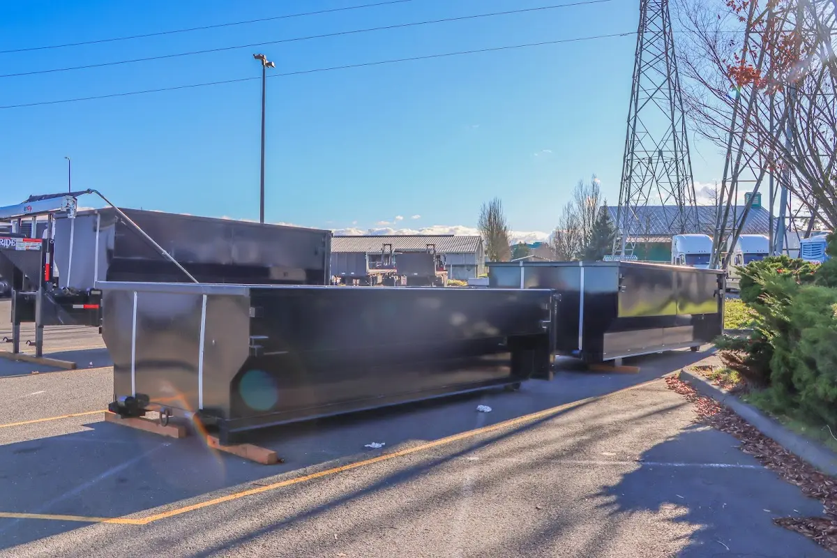 Roll-off dumpster ready for waste disposal at job site for Demolition Dumpster Rental in Carolina Beach